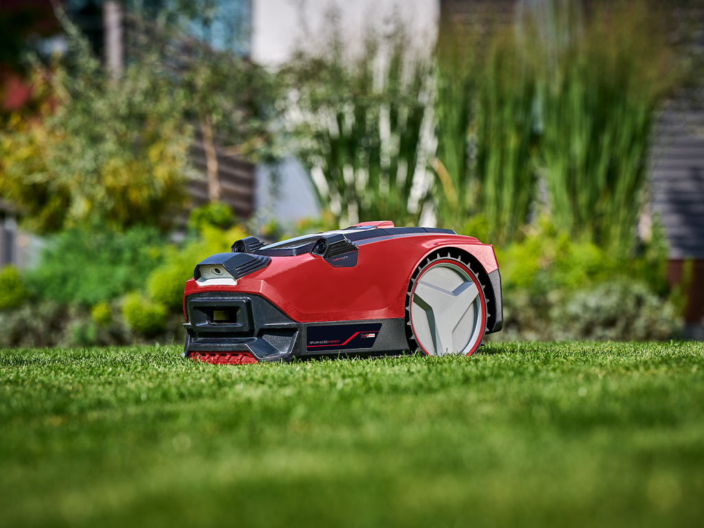 A robotic lawn mower mowing the lawn. 