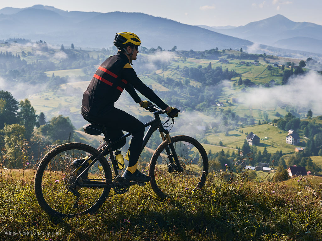 A man riding his bike.