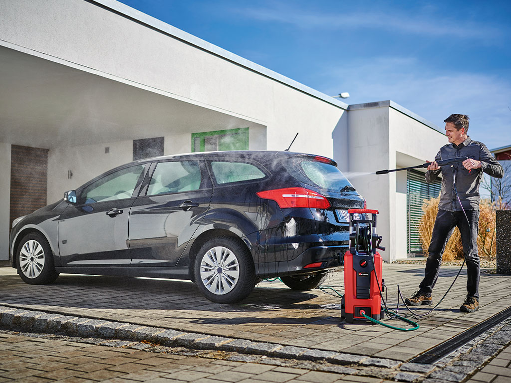 A man cleaning his car.