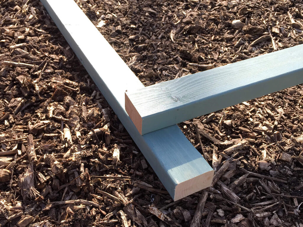Attaching the wood pieces on top of each other.