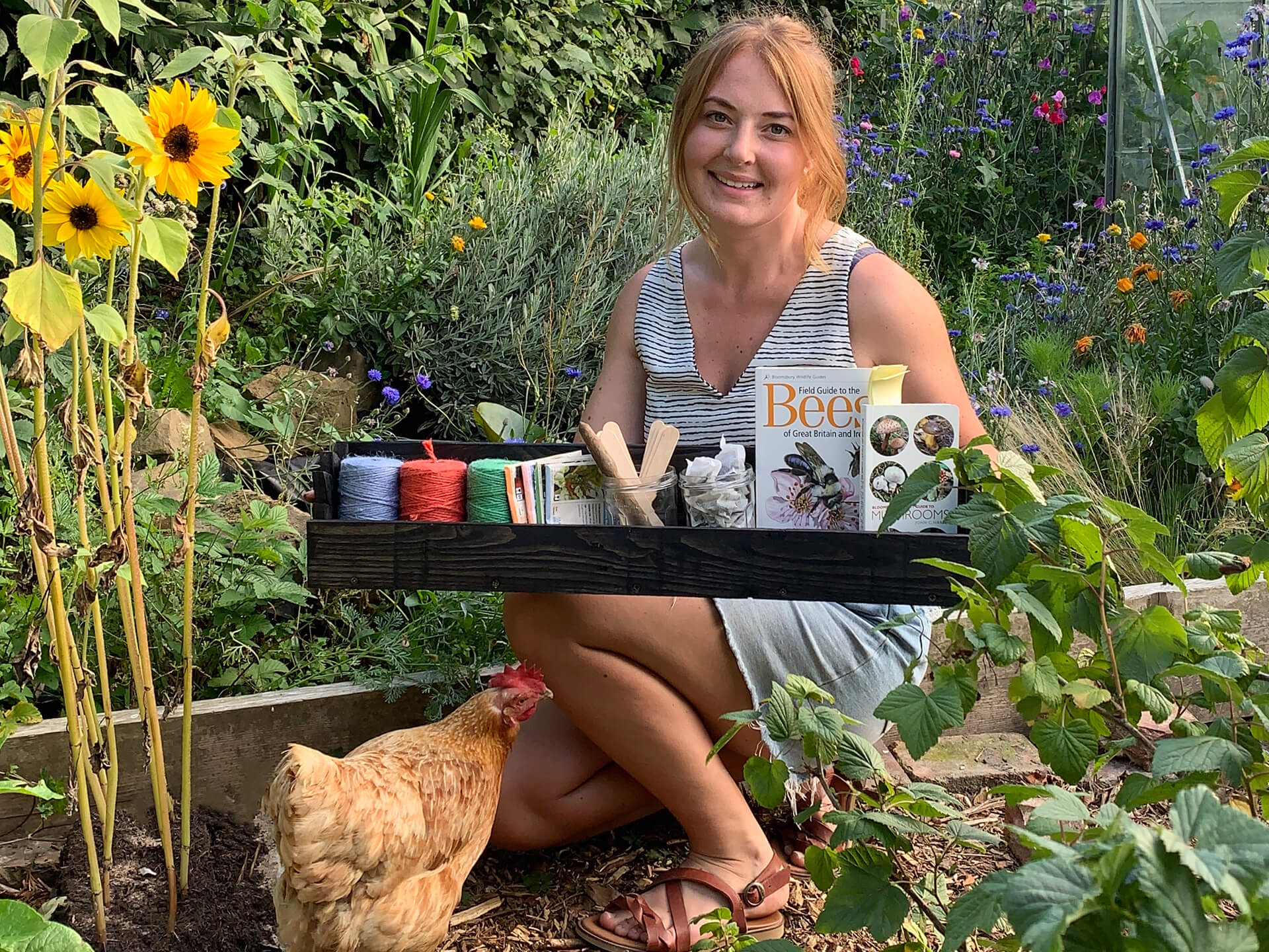 A woman presenting the end result of the pallet shelve. 