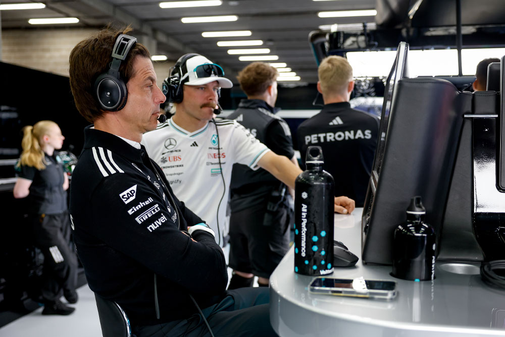 Toto Wolff and Valtteri Bottas from the Mercedes-AMG PETRONAS Formula One Team are seen at the team’s workstation in the garage. They are focused on the race strategy, watching the monitors and communicating via headsets.