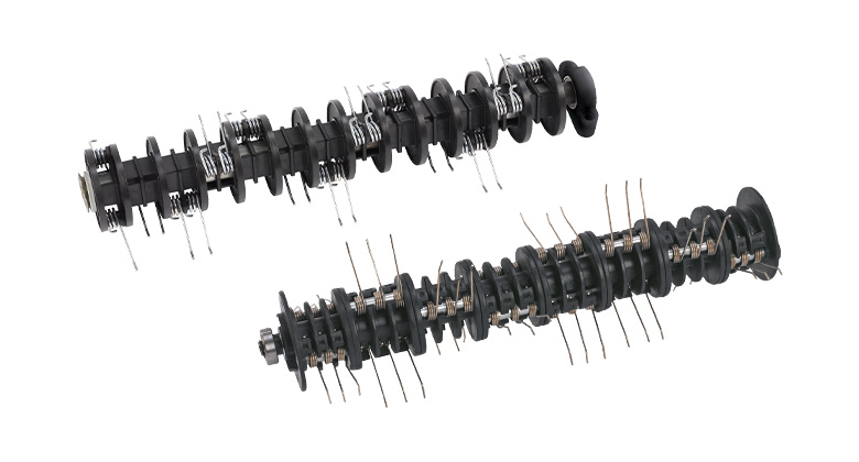 An image of two aerating rollers used in scarifiers to remove thatch and moss and aerate the lawn.
