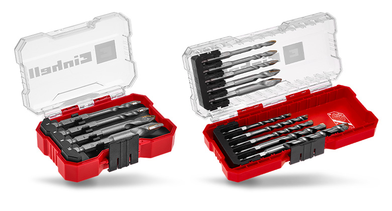 Two open toolboxes displaying various drill bit sets with transparent lids.