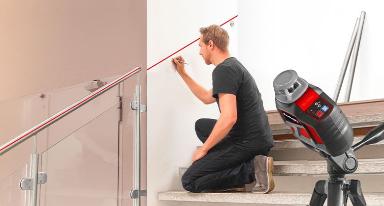 man using a measuring tool