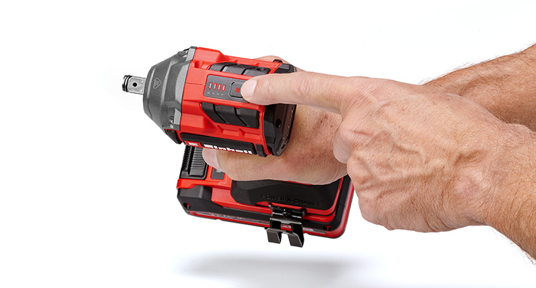 A person points to the settings on a cordless impact wrench.