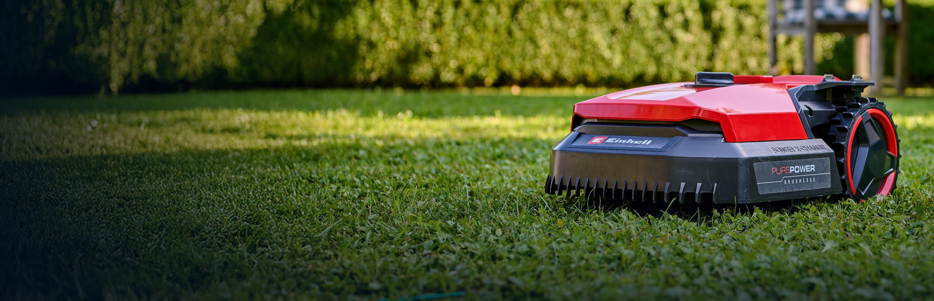 Close-up of an Einhell Freelexo robot lawn mower mowing